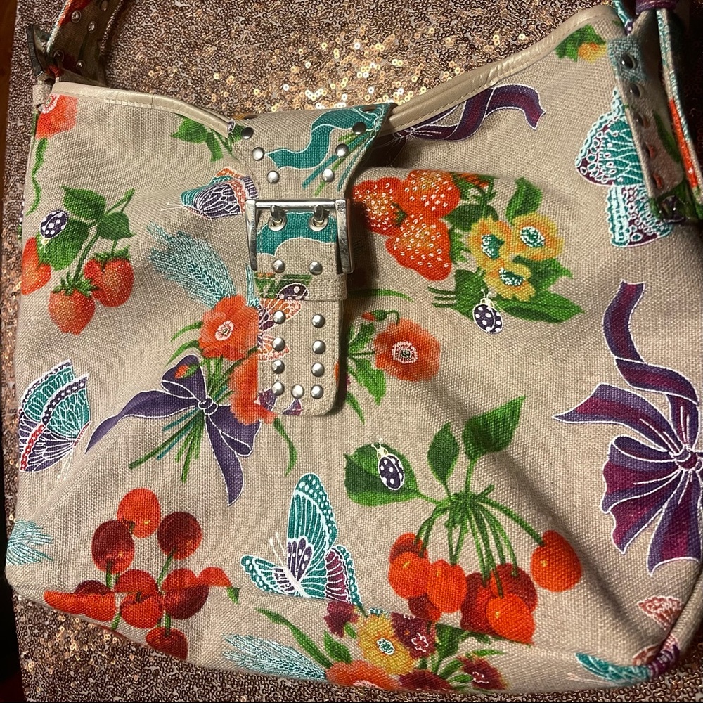 Stuart Weitzman canvas floral & fruit bag with silver grommets.